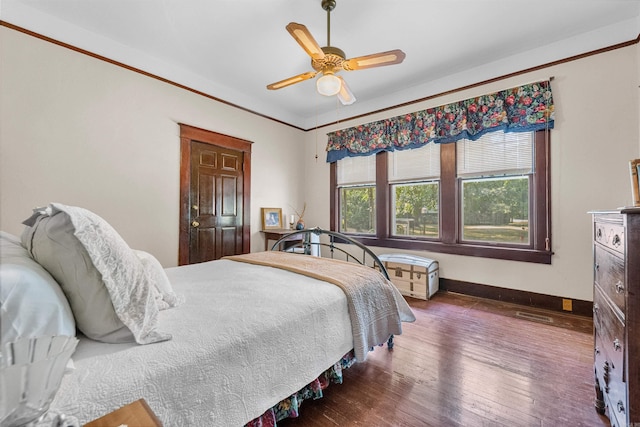 bedroom featuring dark hardwood / wood-style flooring and ceiling fan