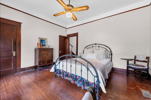 bedroom featuring ceiling fan and dark hardwood / wood-style flooring