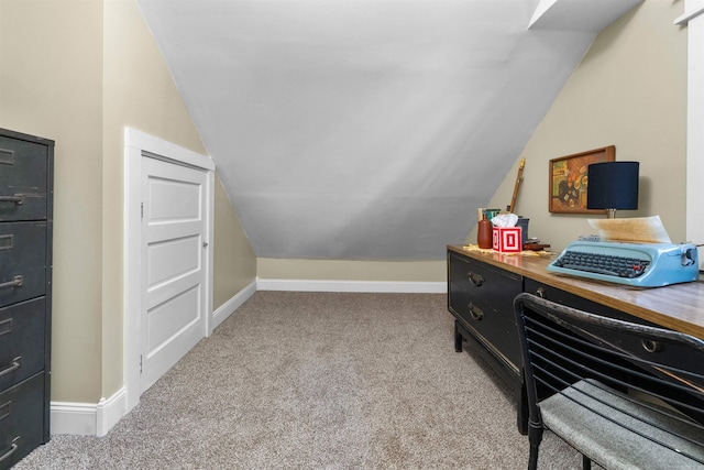 office space with light carpet and lofted ceiling