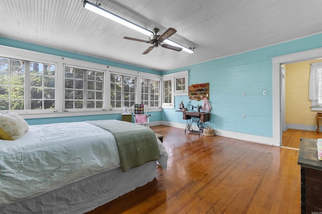 bedroom featuring hardwood / wood-style flooring and ceiling fan