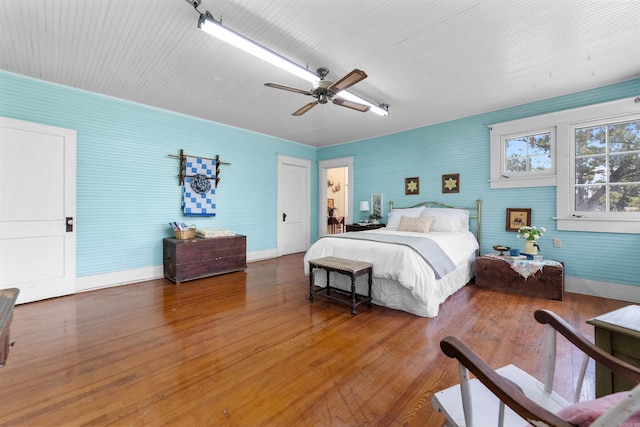 bedroom with hardwood / wood-style floors and ceiling fan