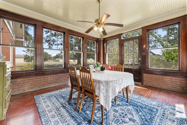 sunroom / solarium with ceiling fan and a healthy amount of sunlight