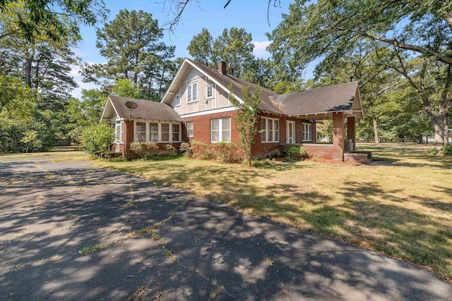 view of home's exterior featuring a yard