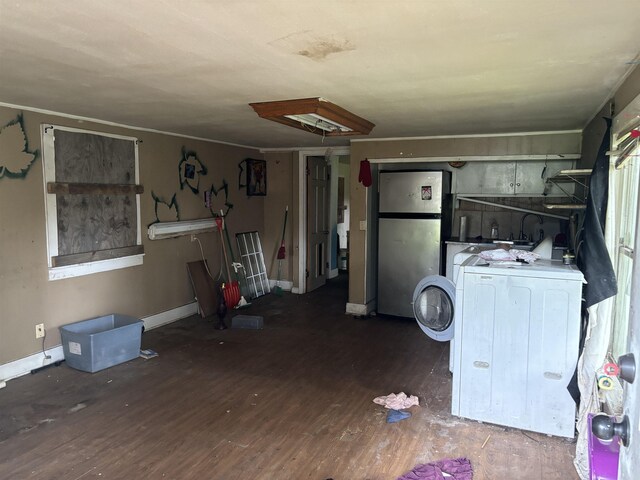 clothes washing area featuring washer / clothes dryer and dark hardwood / wood-style floors