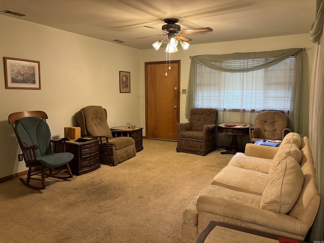 living room featuring ceiling fan and light carpet