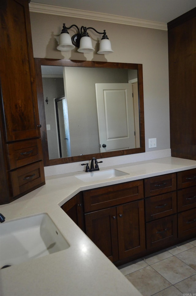 bathroom featuring tile patterned floors, vanity, ornamental molding, and a shower with door