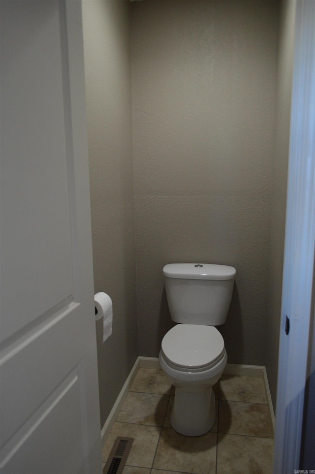 bathroom with tile patterned floors and toilet