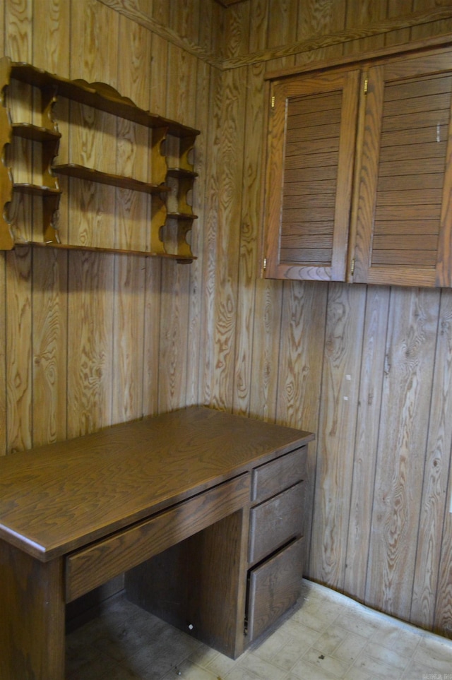 mudroom featuring wooden walls