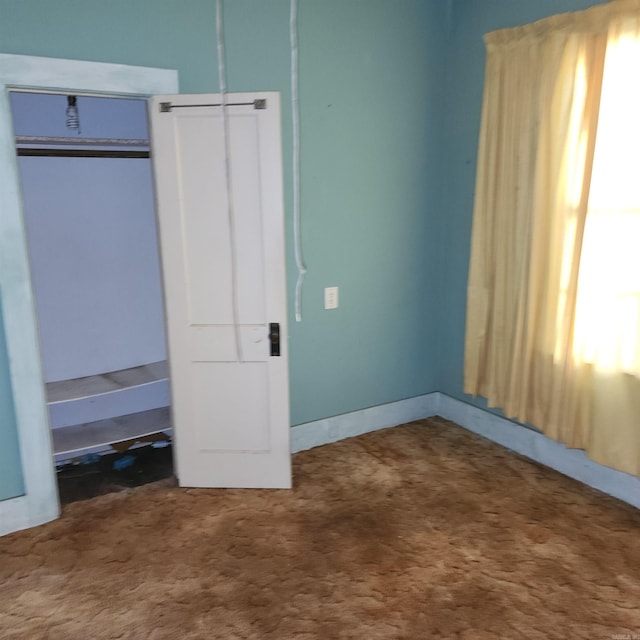 unfurnished bedroom with carpet flooring