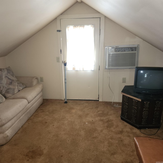 living room with a wall mounted air conditioner, carpet flooring, and lofted ceiling