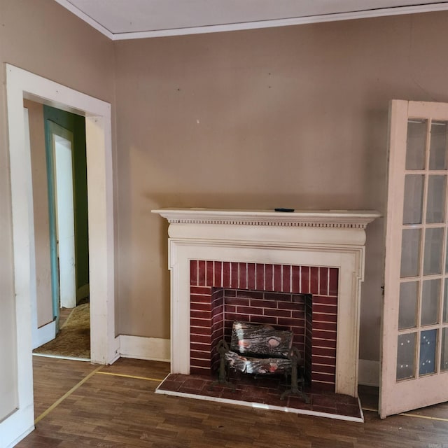 details featuring hardwood / wood-style flooring, ornamental molding, and a fireplace