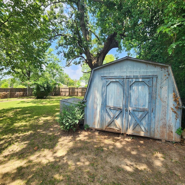 view of outdoor structure with a lawn