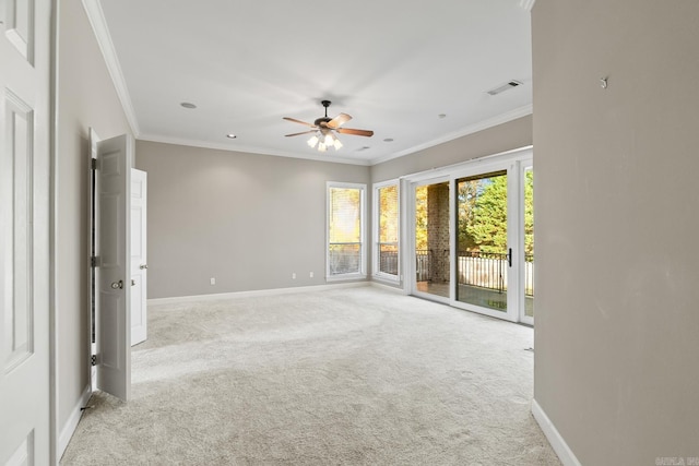 unfurnished room with light carpet, ceiling fan, and ornamental molding