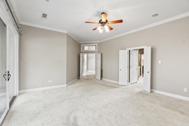 unfurnished bedroom featuring ceiling fan, light colored carpet, and ornamental molding