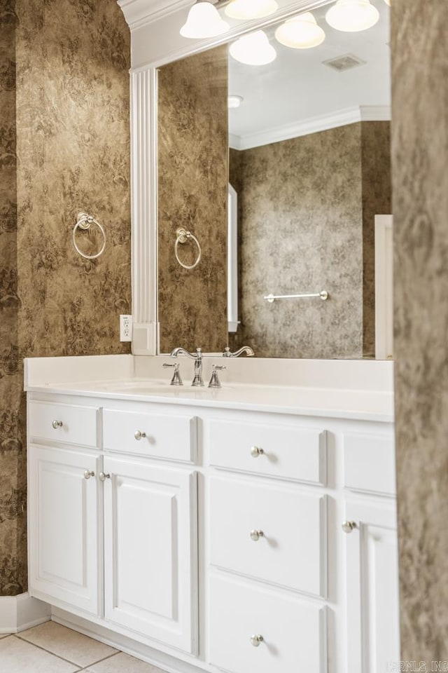 bathroom featuring tile patterned floors, vanity, and crown molding