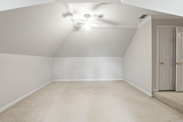 additional living space featuring light carpet, ceiling fan, and vaulted ceiling