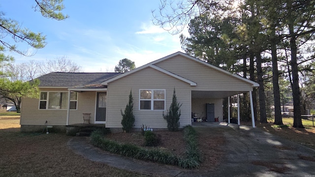 ranch-style house with a carport