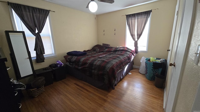 bedroom featuring ceiling fan and hardwood / wood-style floors