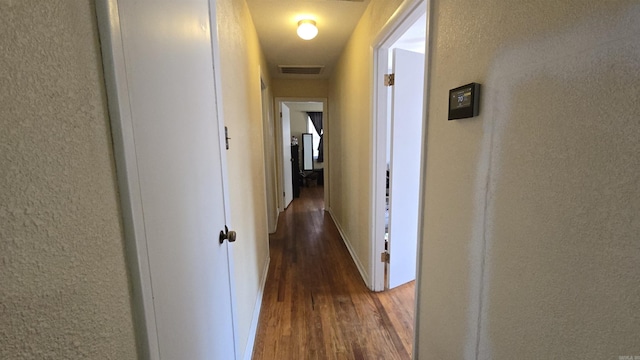 hall with dark hardwood / wood-style floors