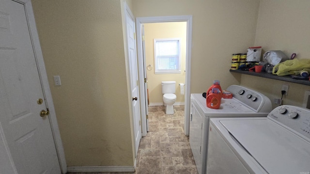 laundry room with washing machine and clothes dryer