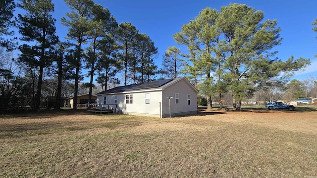 view of property exterior featuring a lawn