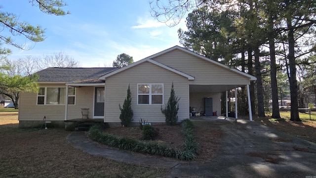 view of front of home featuring a carport