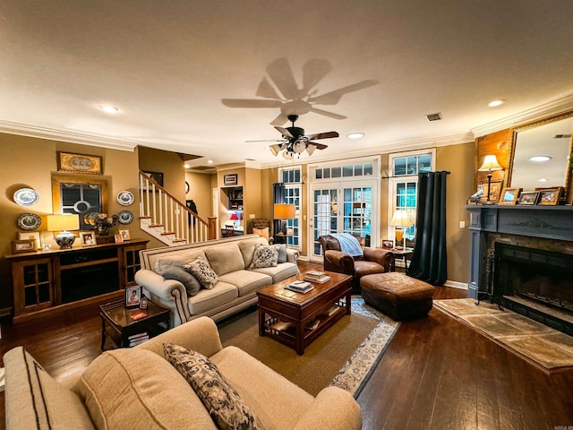 living room with ornamental molding, french doors, dark wood-type flooring, and ceiling fan