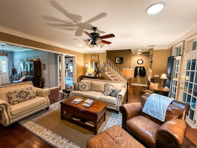 living room featuring hardwood / wood-style flooring, ceiling fan, ornamental molding, and ornate columns