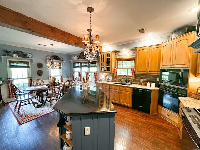 kitchen with sink, hanging light fixtures, an inviting chandelier, a kitchen island, and black appliances