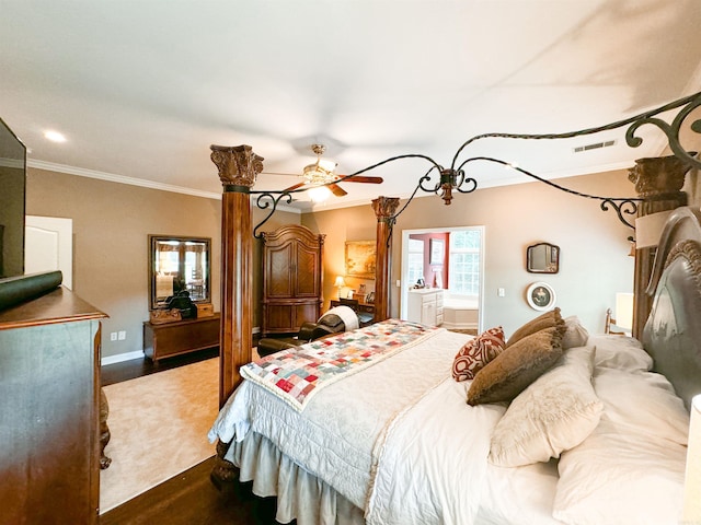 bedroom featuring hardwood / wood-style flooring, ensuite bathroom, ceiling fan, and ornamental molding