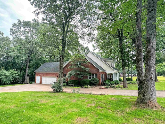 view of front facade with a front yard and a garage