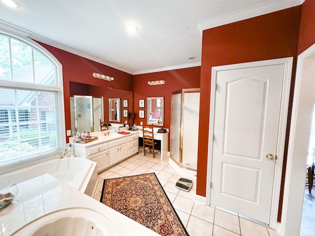 bathroom featuring plus walk in shower, vanity, tile patterned floors, and crown molding