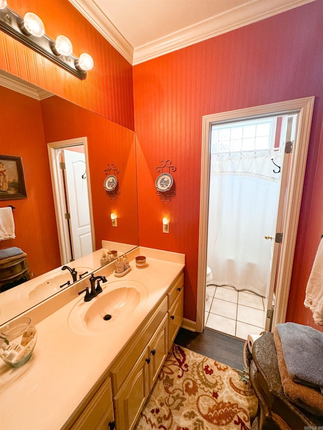 bathroom with curtained shower, tile patterned floors, toilet, vanity, and ornamental molding