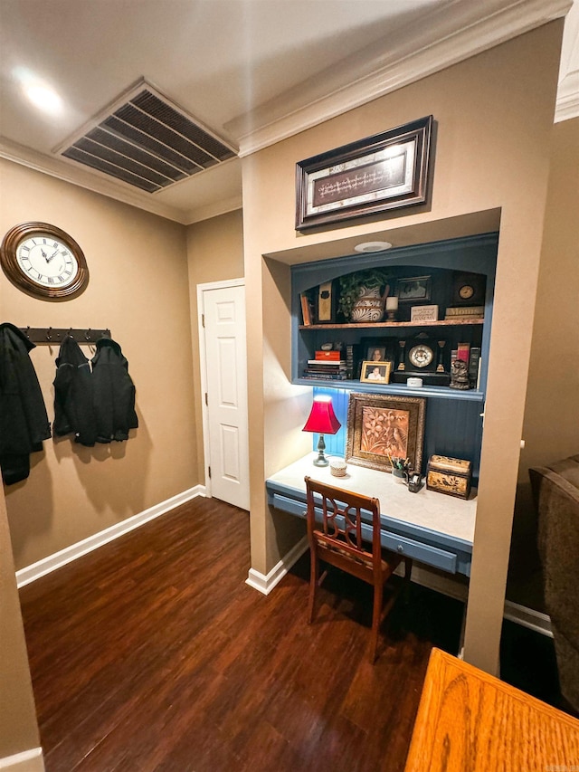 interior space featuring dark hardwood / wood-style floors, ornamental molding, and built in shelves