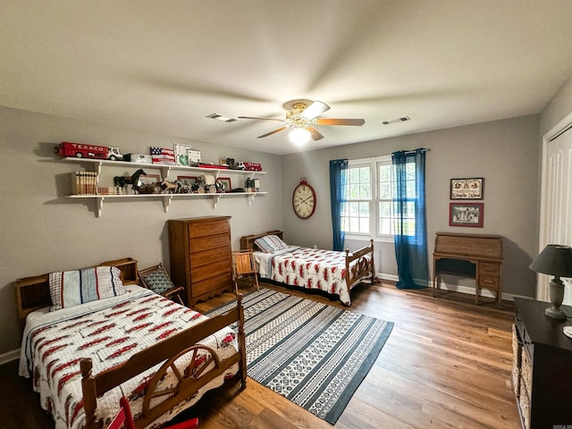 bedroom with hardwood / wood-style floors and ceiling fan