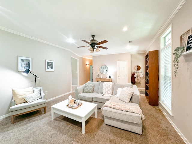 carpeted living room featuring ceiling fan and ornamental molding