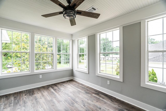 unfurnished sunroom featuring ceiling fan