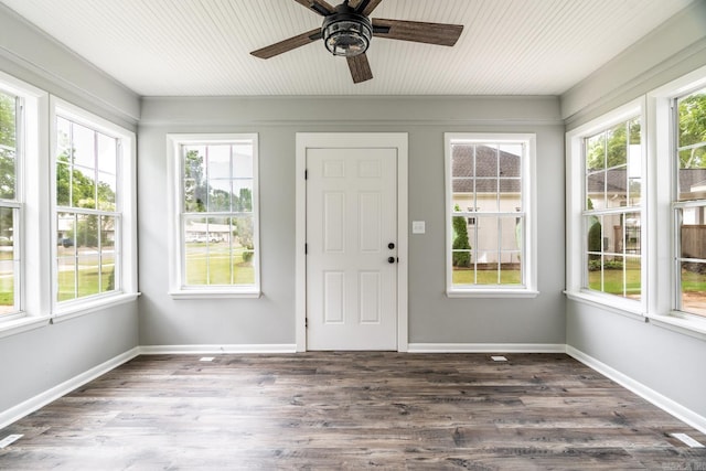 unfurnished sunroom with ceiling fan and plenty of natural light