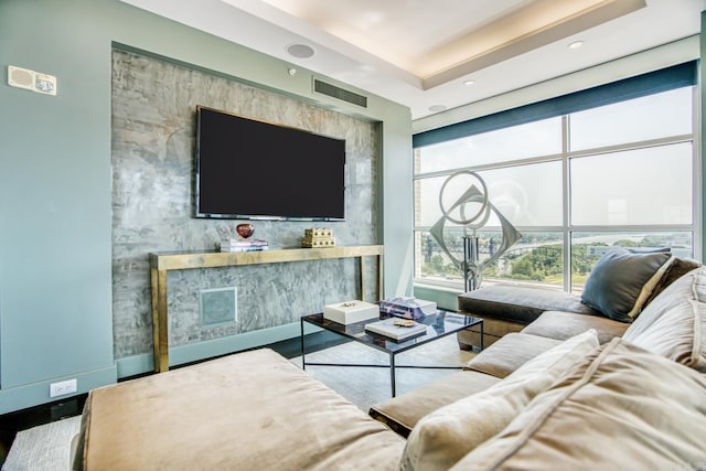 living room with a raised ceiling