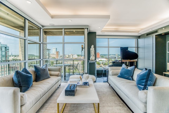 living room featuring expansive windows and a wealth of natural light