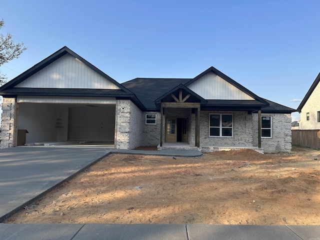 view of front of house featuring a porch and a garage