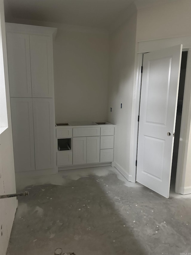 spare room featuring concrete flooring