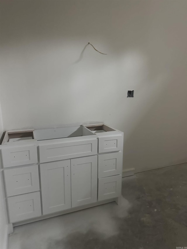 bathroom with concrete flooring