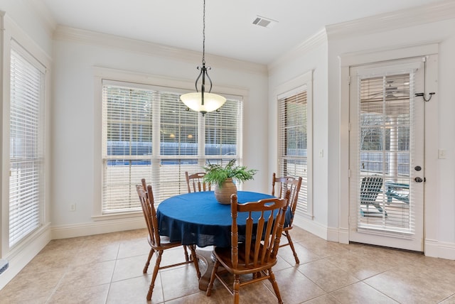 dining room with light tile patterned flooring and ornamental molding