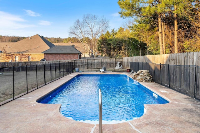 view of swimming pool with pool water feature