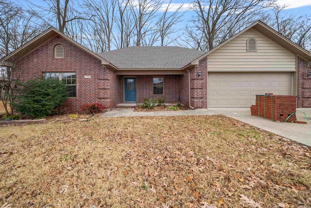 ranch-style house with a garage and a front yard