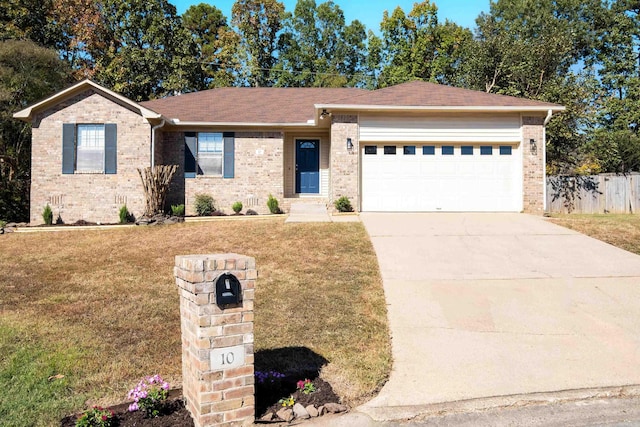 ranch-style house featuring a front lawn and a garage