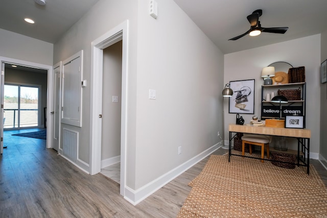 office featuring wood-type flooring and ceiling fan