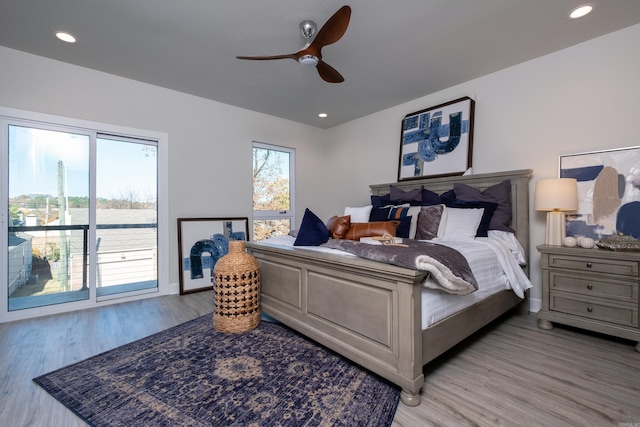 bedroom with access to outside, ceiling fan, and light hardwood / wood-style floors