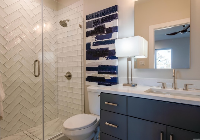 bathroom with vanity, toilet, and an enclosed shower